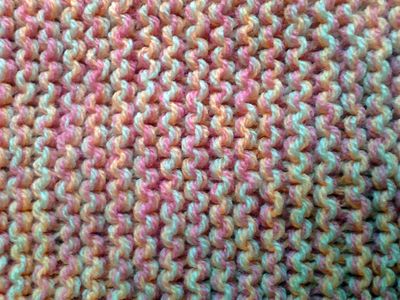 Close-up of stitches, 3 colours interwoven